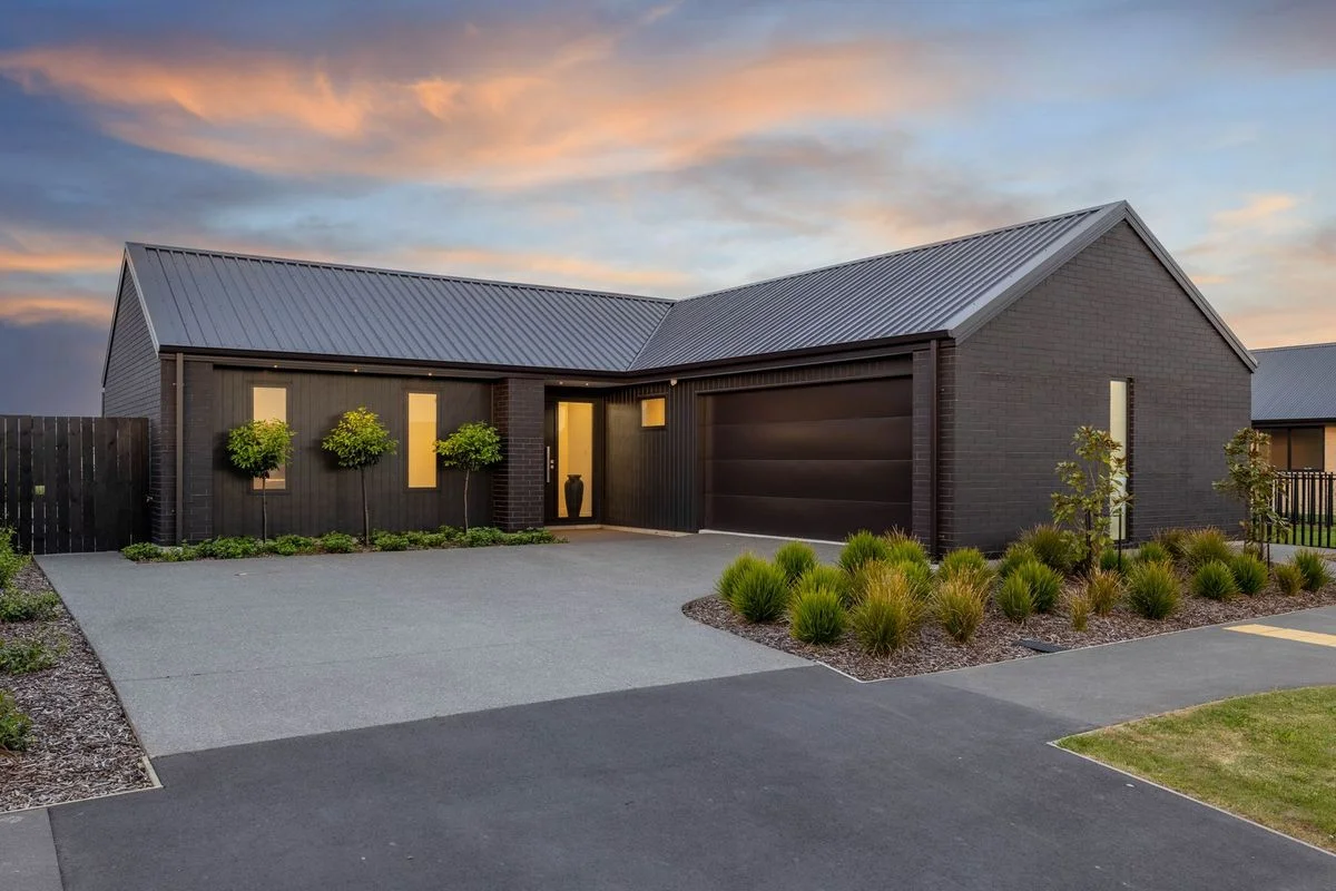 Black and White Modern Home with Bold Garage Door Design
