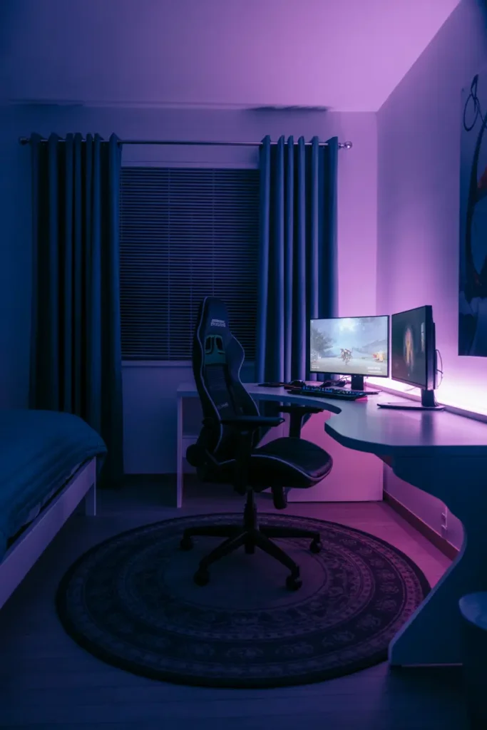 10. Cozy Purple Neon Gaming Bedroom Setup