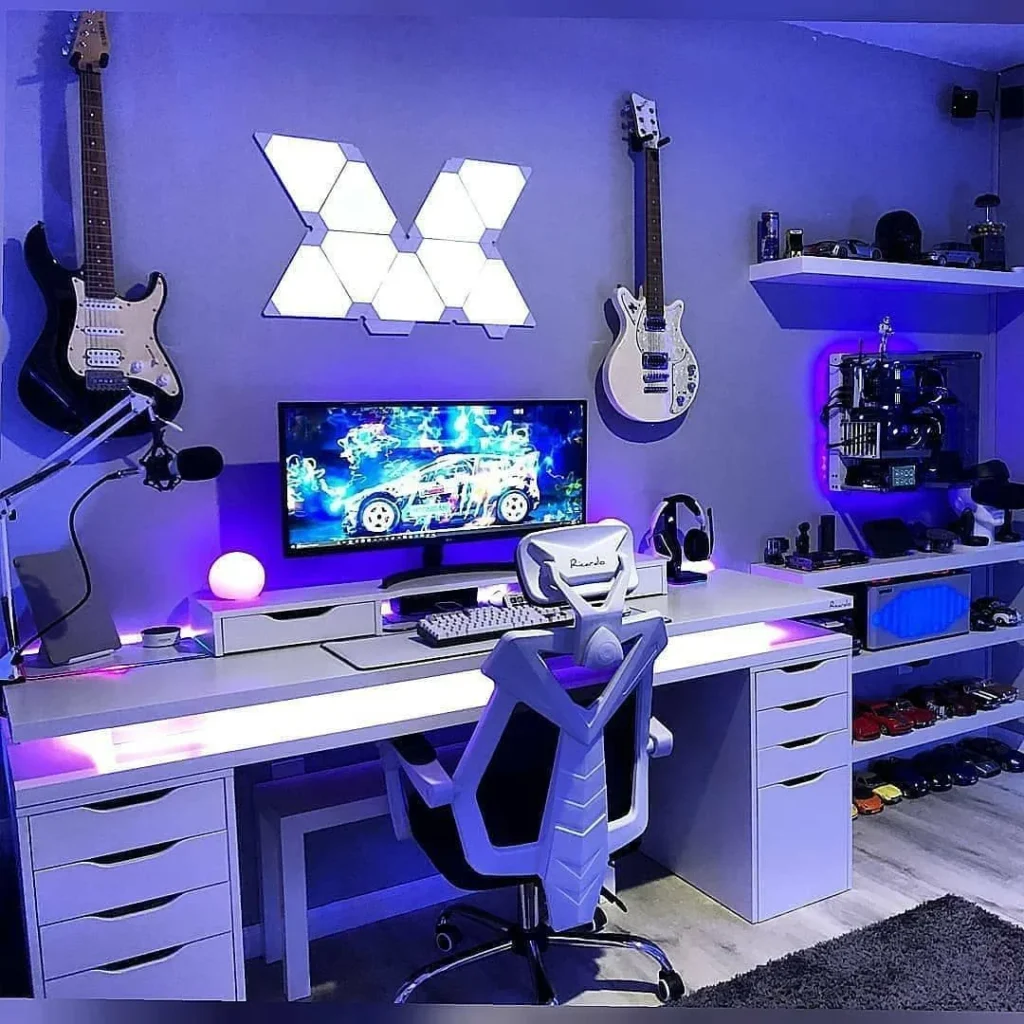 Vibrant Blue Neon Gaming Desk Setup with Guitar