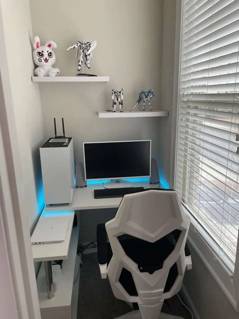 Modern White Gaming Desk Setup with Mecha Figurines