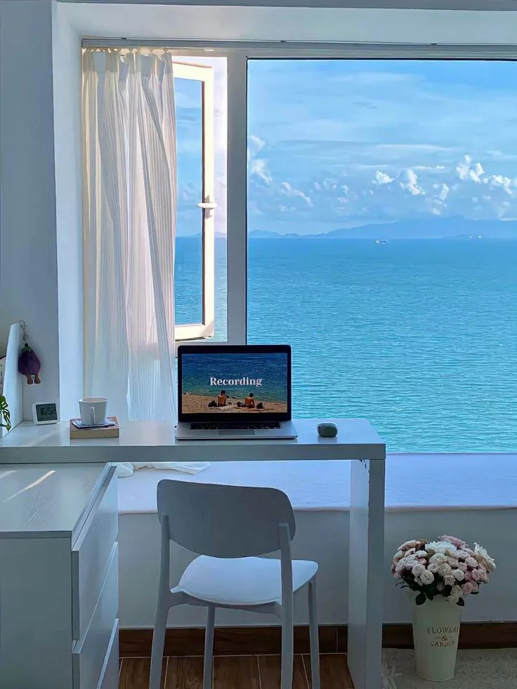 Tranquil Blue Minimalist Desk Setup with Ocean View