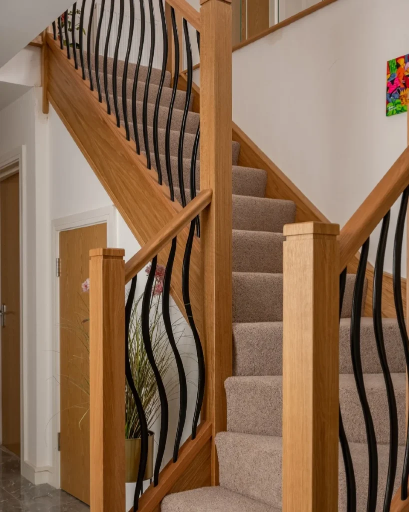 15 Staircase Railing Design Ideas for Stylish Homes 7 Wooden Handrail with Metal Balusters