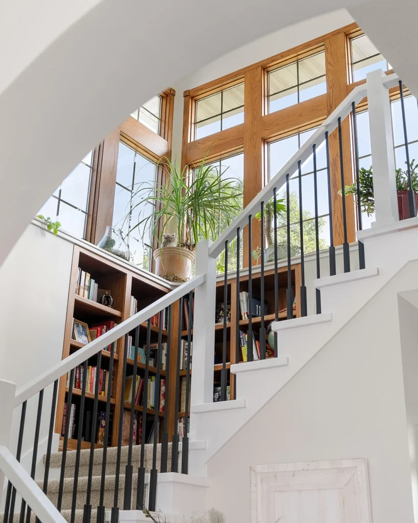 15 Double Height Staircase Wall Design Ideas 33 Staircase Wall with Built In Shelving