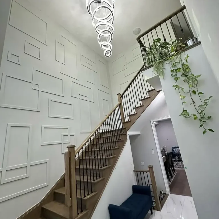 Double height staircase wall design