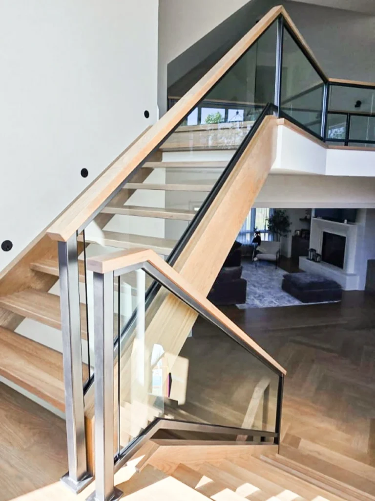 15 Iron Staircase Railing Ideas for Stylish Homes 33 Iron Railing with Glass Panels