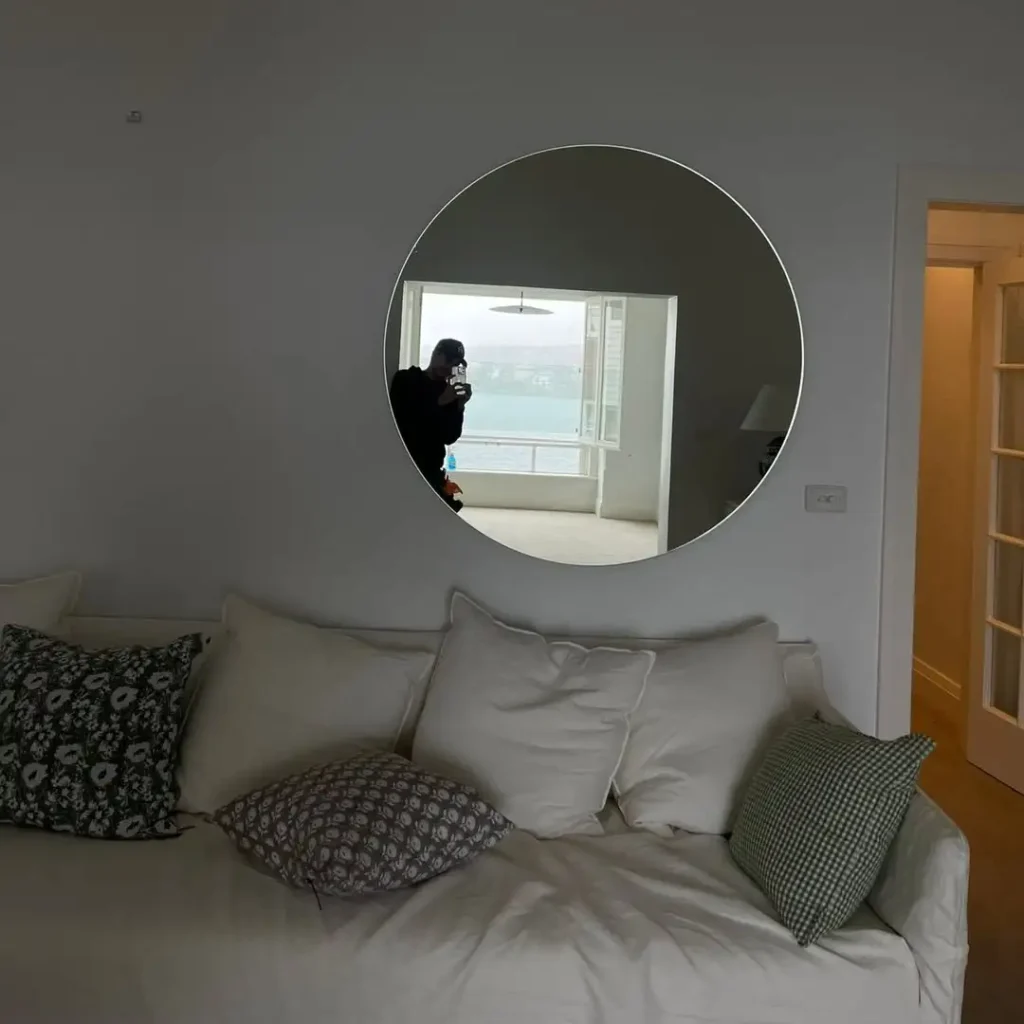 Round Mirrors Above Sofa