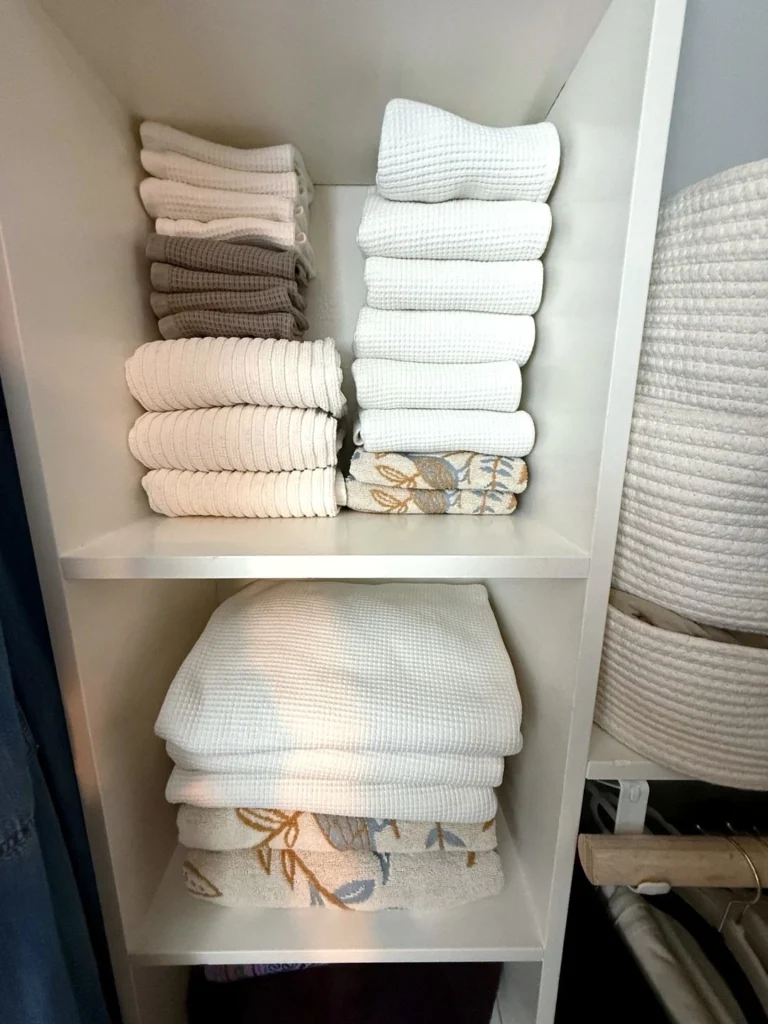 15 Linen Closet Organization Ideas For a Tidy Home 1 Rolled Towel Storage Shelves